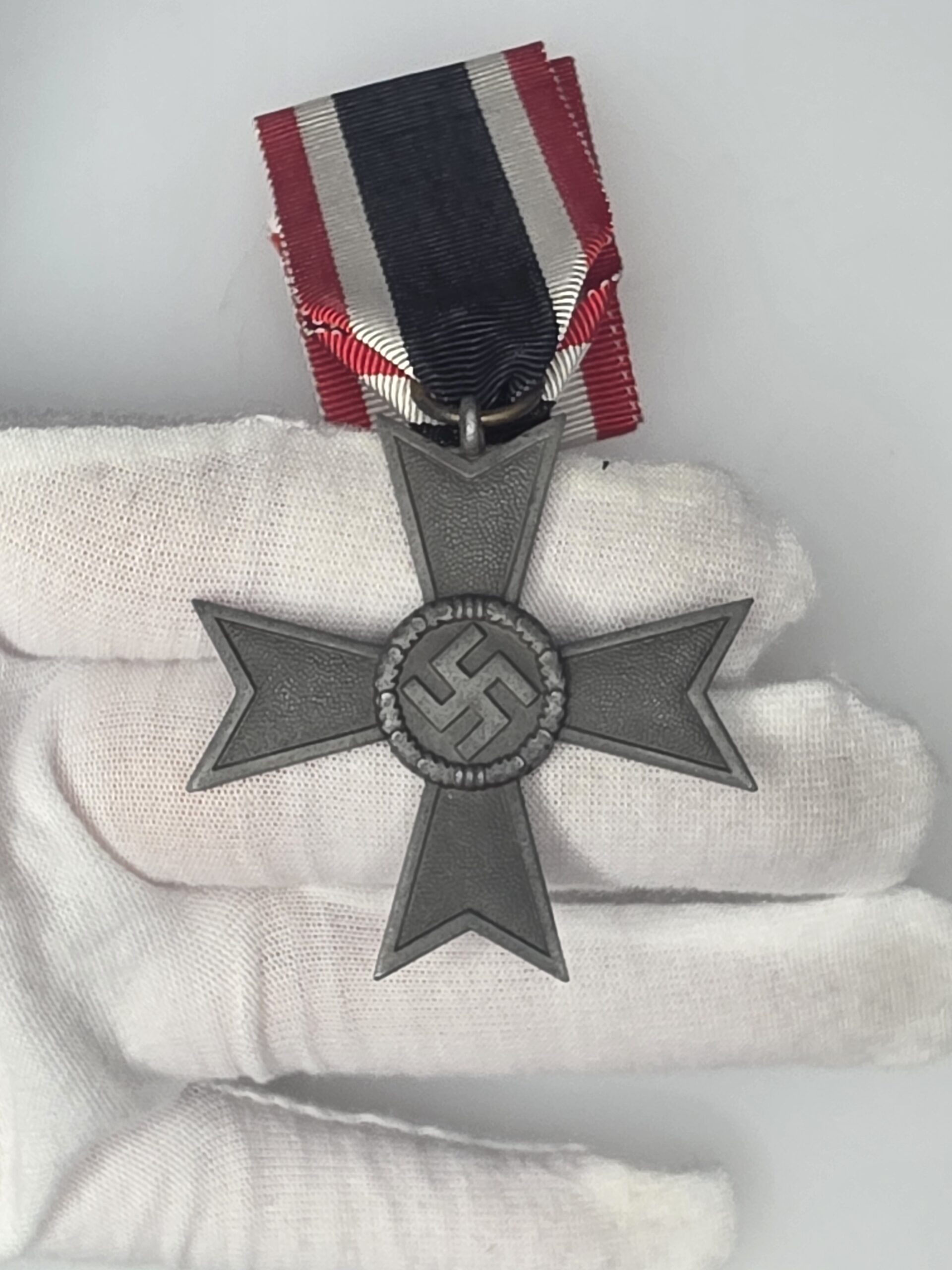 Zinc Kriegsverdienstkreuz ohne Schwerter 2nd Class 1939 obverse with ribbon