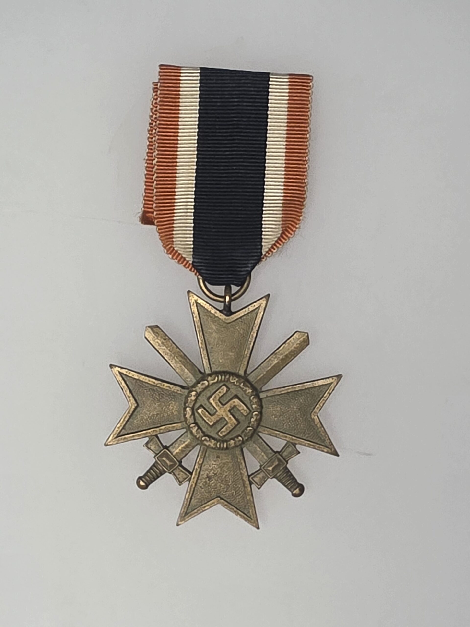 Aged bronze Kriegsverdienstkreuz 2nd Class with Swords 1939 with ribbon
