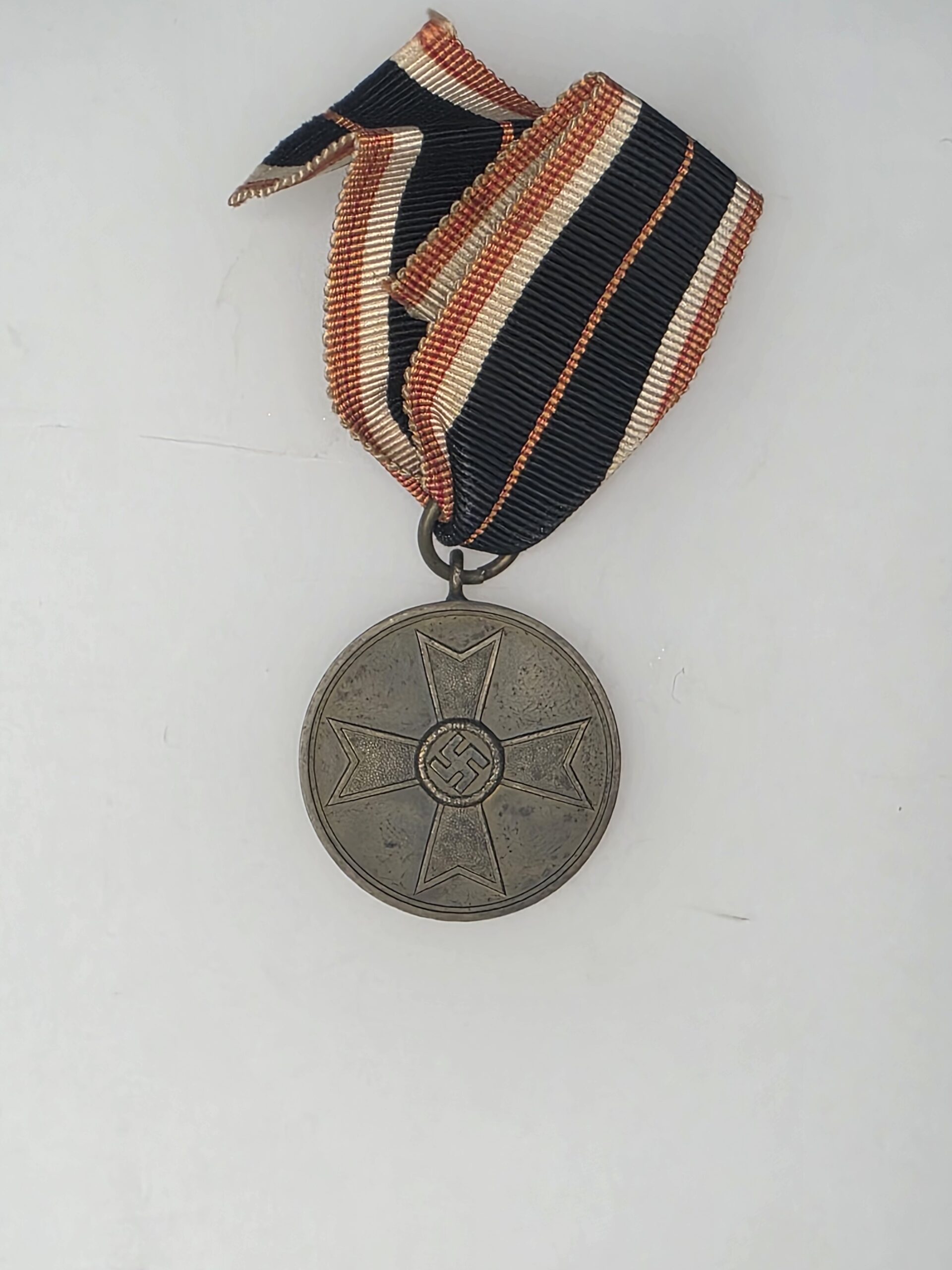 Aged German Kriegsverdienstmedaille 1939 War Merit Medal with ribbon