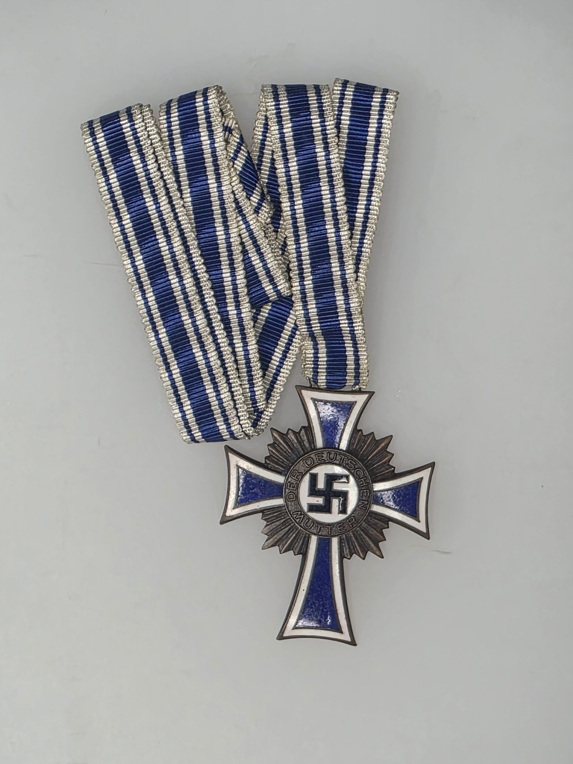 Bronze German Mother’s Cross Ehrenkreuz der Deutschen Mutter with blue white ribbon