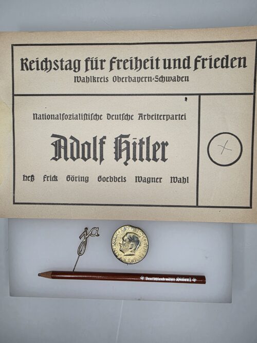 Original Hitler propaganda pencil and two Third Reich election badges