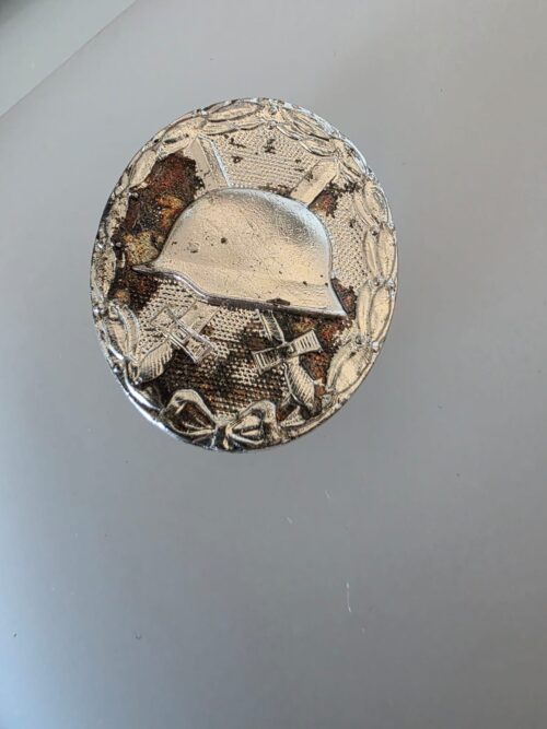 Original German 1957 Silver Wound Badge with helmet crossed swords and laurel wreath