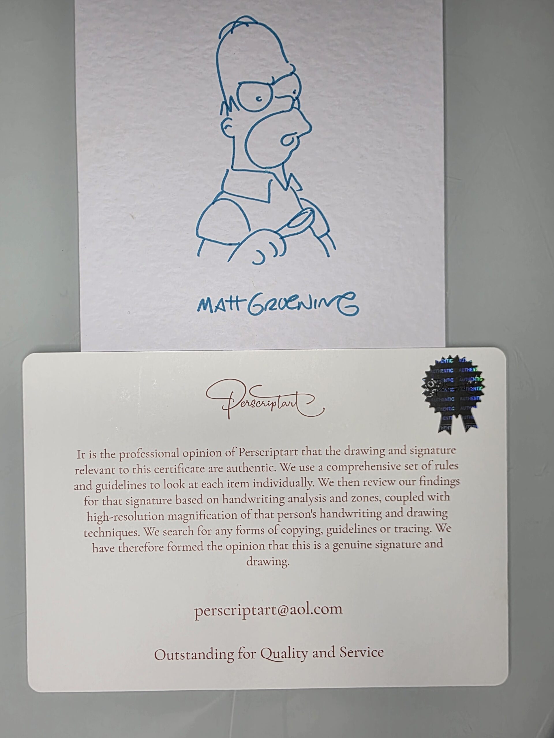 Matt Groening Homer Simpson Drawing – Full View Matt Groening Homer drawing signed in blue ink on white textured card