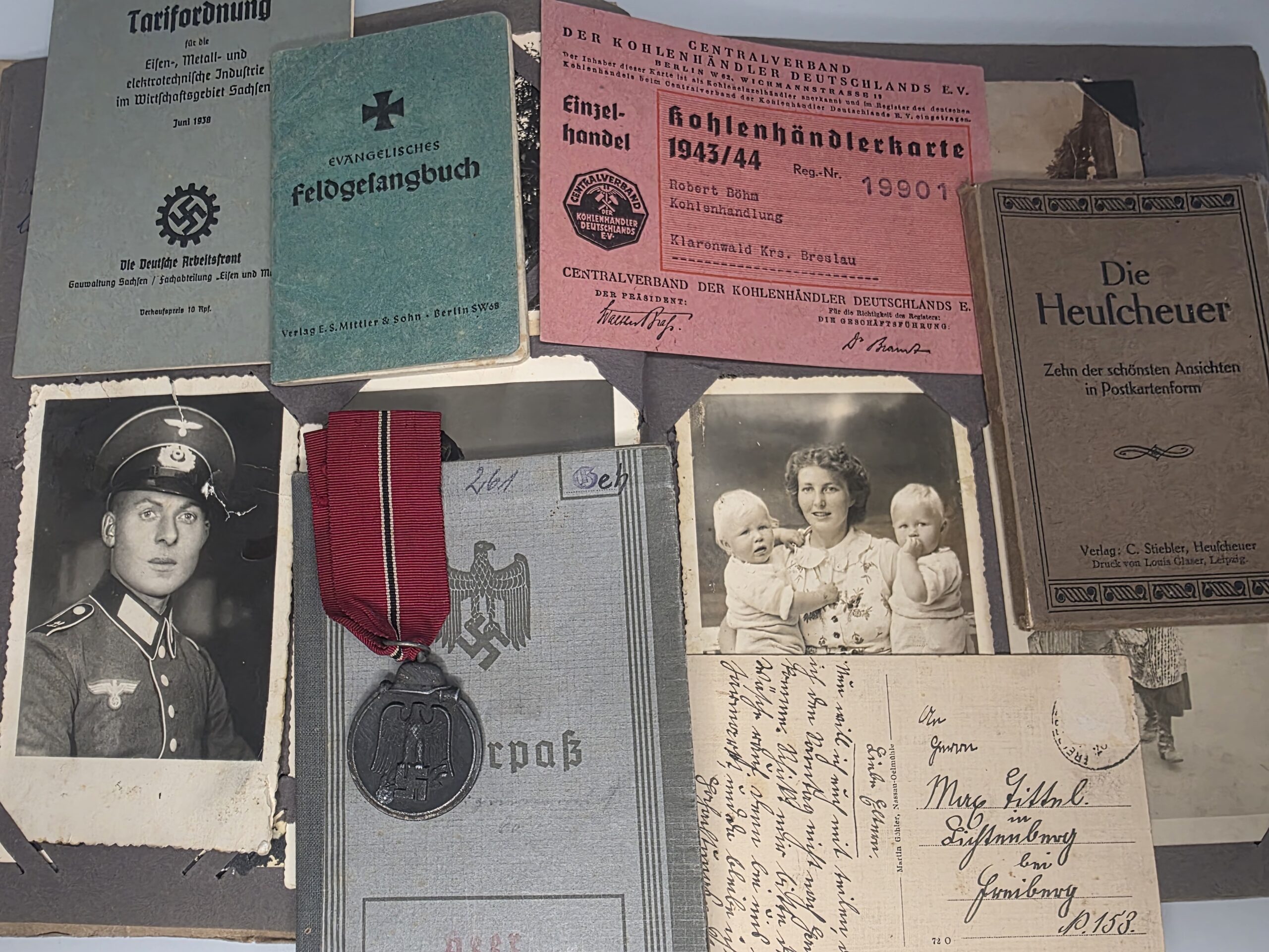 WWII German Wehrpass archive with Ostmedaille, photographs and wartime documents