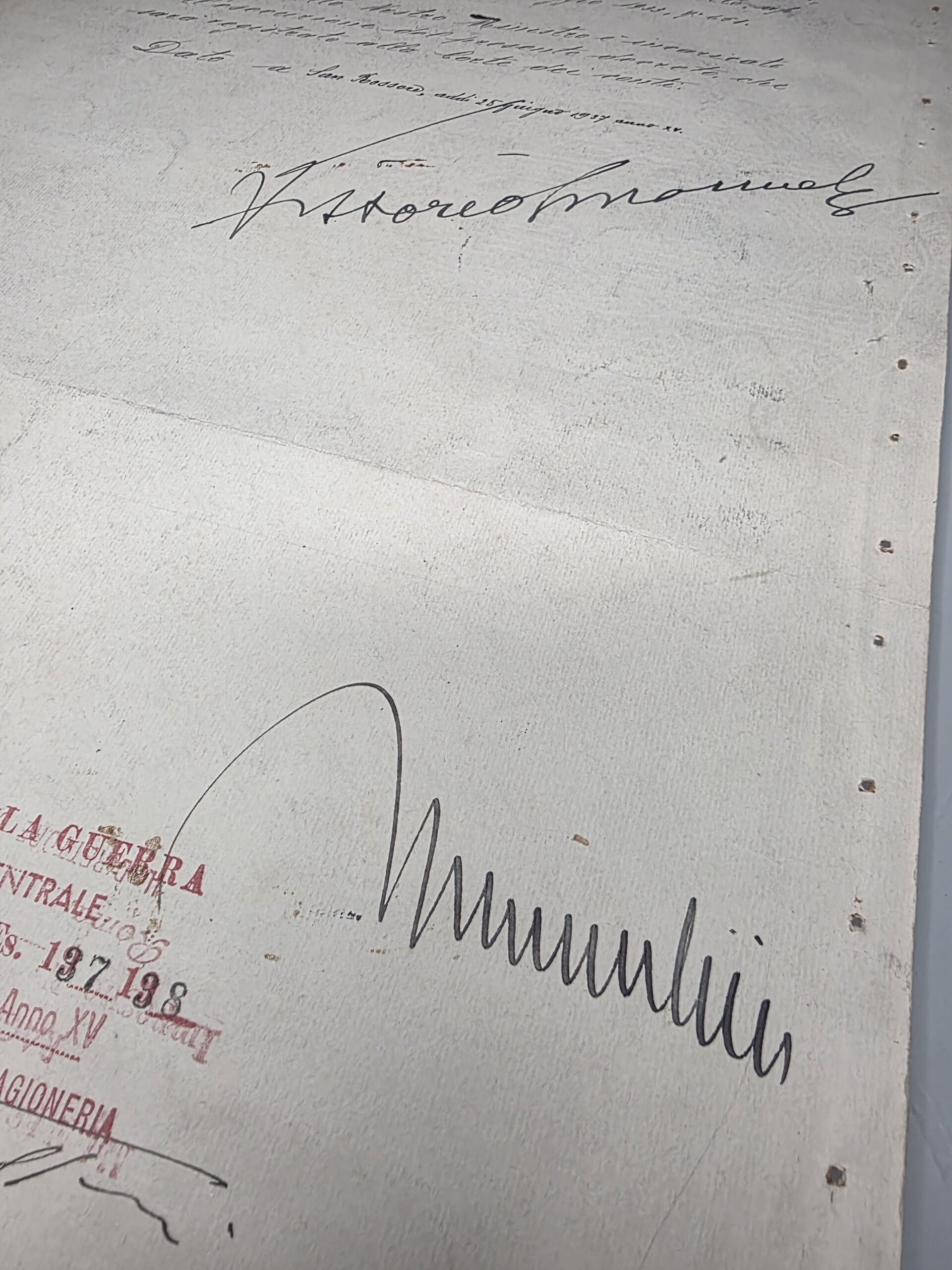Close-up of Benito Mussolini and Vittorio Emanuele III signatures